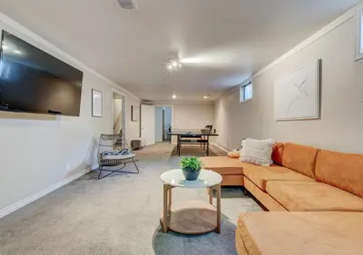 a living room with a couch and a table at Denver Hot Tub Retreat Near Downtown - 20 Percent Off Feb in Westminster