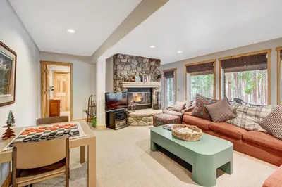 a living room with a couch and a fireplace at Beautiful 5br Home at The Ranch - Kids Ski Free! condo in Keystone