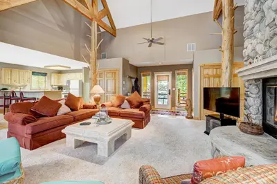 a living room with couches and a fireplace at Beautiful 5br Home at The Ranch - Kids Ski Free! condo in Keystone