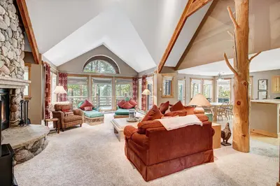 a living room with a couch and a fireplace at Beautiful 5br Home at The Ranch - Kids Ski Free! condo in Keystone