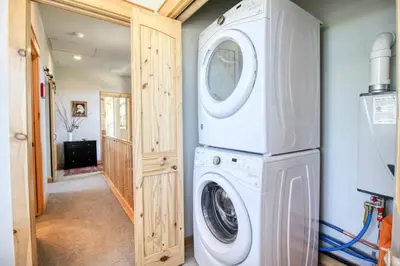 a laundry room with a washer and dryer at Modern 3bd cabin in Edgewater in Granby
