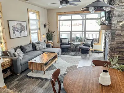 a living room with a couch and a table at Cozy 3 bedroom Mountain Getaway - Ski Fish Golf in Granby