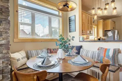 a dining room table and chairs in a kitchen at Cozy 3 bedroom Mountain Getaway - Ski Fish Golf in Granby