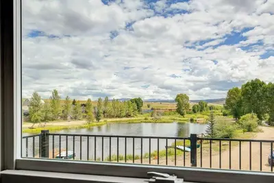 a view of a lake from a window at Cozy 3 bedroom Mountain Getaway - Ski Fish Golf in Granby