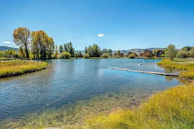 a view of a river with ducks in it at Cozy 3 bedroom Mountain Getaway - Ski Fish Golf in Granby