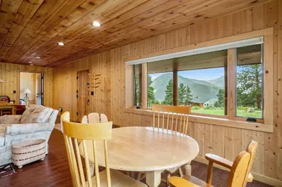 a dining room with a table and chairs in a room at Frontier Mountain Retreat - Monthly Long-Term Vacation Rental 30 Days Minimum -- Estes Park apts in Estes Park