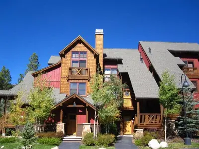 a large wooden house with a gambrel at The Seasons Keystone 2 Bedroom In Lakeside Village in Keystone