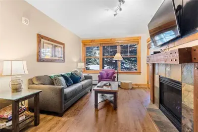 a living room with a couch and a fireplace at 2 Bedroom Condo At The Springs In River Run Village in Dillon