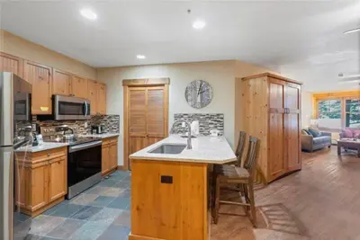 a kitchen with a sink and a stove top oven at 2 Bedroom Condo At The Springs In River Run Village in Dillon