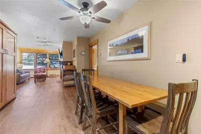 a dining room with a wooden table and chairs at 2 Bedroom Condo At The Springs In River Run Village in Dillon
