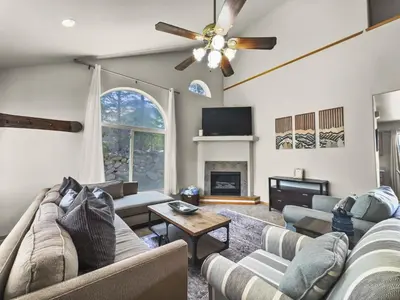 a living room with couches and a ceiling fan at 173 Buffalo Drive townhouse in Silverthorne