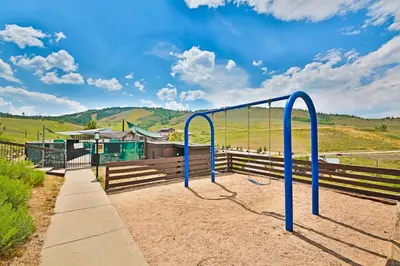 a batting cage in front of a fence at The Mountainside - Unit B47 in Granby