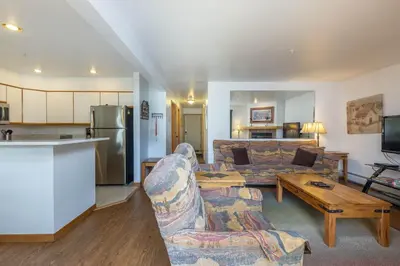 a living room with a couch and a table at 113 Cinnamon Ridge condo in Keystone