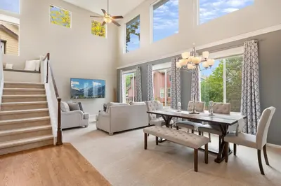 a dining room with a table and chairs at Large home, Fenced in Back Yard, Cathedral Ceiling in Commerce City