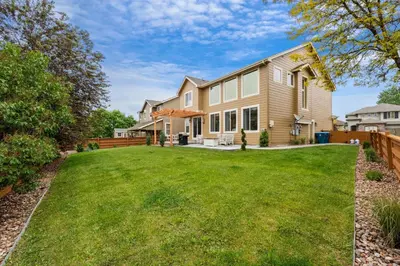 a house with a large yard at Large home, Fenced in Back Yard, Cathedral Ceiling in Commerce City