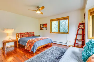 a bedroom with a bed and a wooden floor at Frisco River Gem Close to Slopes, Trails and Main St in Frisco