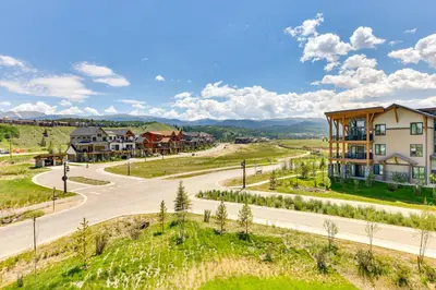 an empty road in a village with a house at Mountain-View Fraser Condo with Balcony and Hot Tub! in Fraser