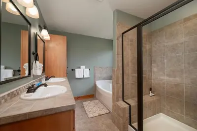 a bathroom with a sink and a shower and a tub at 2002 Lupine Lane in Tabernash