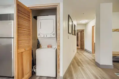 a washer and dryer in a hallway of a house at 8256 Silver Mill condo in Keystone