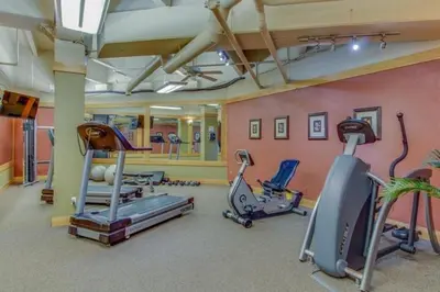 a gym with several exercise equipment in a room at 8256 Silver Mill condo in Keystone