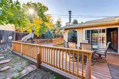 a house with a deck with a dog statue on it at Pet-Friendly Gem with Private Yard in Westminster! in Westminster