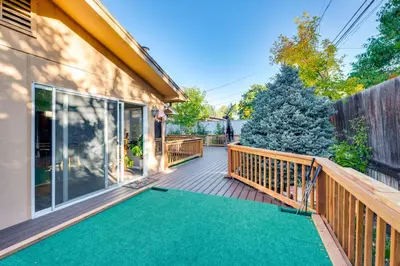 a deck with a green mat on a house at Pet-Friendly Gem with Private Yard in Westminster! in Westminster