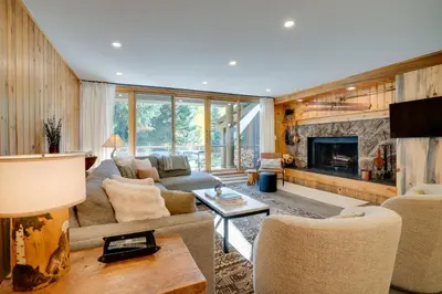 a living room with a couch and a fireplace at Family-Friendly Condo with Mtn Views in Keystone! in Keystone