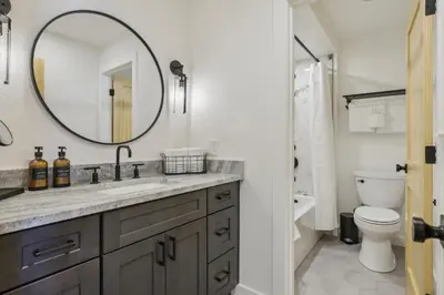 a bathroom with a sink and a mirror at Family-Friendly Condo with Mtn Views in Keystone! in Keystone