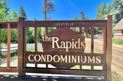 a sign for the rapidsordominesoundsounds at On the Rapids in Grand Lake
