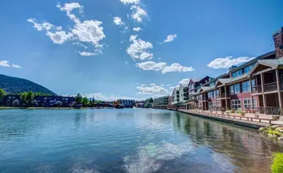 a view of a river with houses and buildings at 2 Bedroom Montezuma Condo At Lakeside Village - Shuttle To Slopes! in Keystone