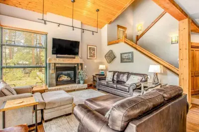 a living room with a couch and a fireplace at Lovely Townhome A Half-Mile From Keystone Gondola Wshared Hot-Tub & Excellent Views in Dillon