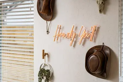 a sign that says happy new year hanging on a wall at Wild West Disco Haus! Sleeps 12, Hot Tub + Gym! in Denver