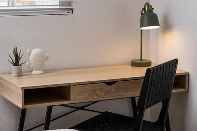a wooden desk with a lamp and a chair at Wild West Disco Haus! Sleeps 12, Hot Tub + Gym! in Denver