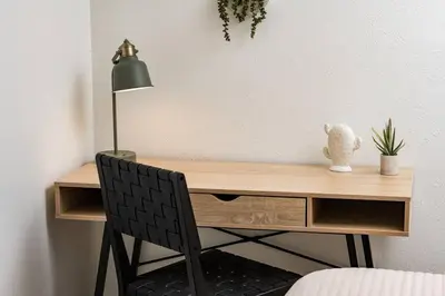 a desk with a lamp and a black chair at Wild West Disco Haus! Sleeps 12, Hot Tub + Gym! in Denver