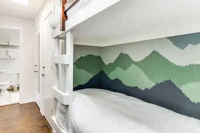 a bedroom with a bunk bed with a green wall at 1 Mi to Keystone Resort Mtn-View Family Escape! in Keystone