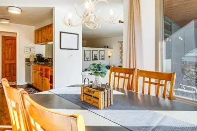 a kitchen and dining room with a table and chairs at 1 Mi to Keystone Resort Mtn-View Family Escape! in Keystone