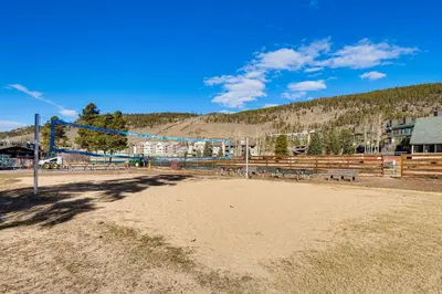 a volleyball court in a field with a mountain at 1 Mi to Keystone Resort Mtn-View Family Escape! in Keystone
