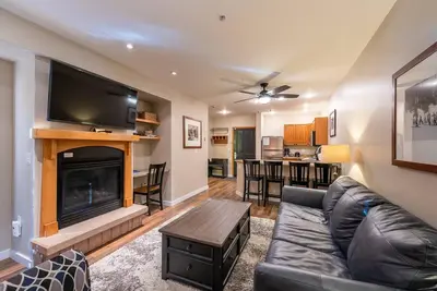 a living room with a couch and a fireplace at Ski-In/Ski-Out Zephyr 1 Bedroom Condo Winter Park in Winter Park