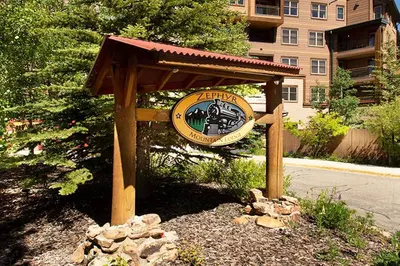 a sign for a train station on the side of a street at Ski-In/Ski-Out Zephyr 1 Bedroom Condo Winter Park in Winter Park