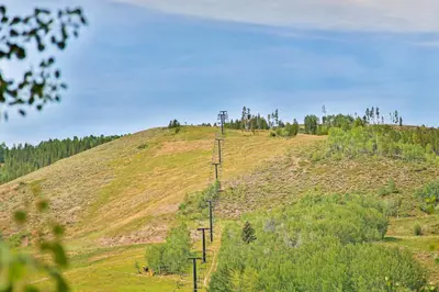 a hill with power lines on top of it at 310 Base Camp in Granby