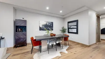 a dining room with a table and chairs at Winter Park Condo w/Hot Tub & 4 Mi to Skiing in Winter Park