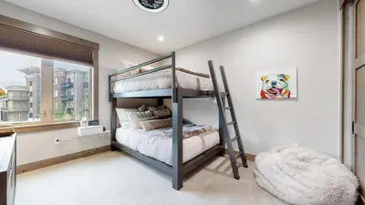 a bedroom with a bunk bed and a window at Winter Park Condo w/Hot Tub & 4 Mi to Skiing in Winter Park