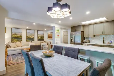 a kitchen and living room with a table and chairs at Hot Tub Family Gem 3 Mi to Frisco Nordic Center in Frisco