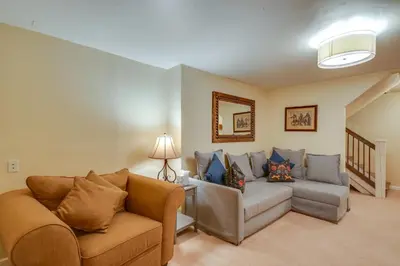 a living room with a couch and a chair at Hot Tub Family Gem 3 Mi to Frisco Nordic Center in Frisco
