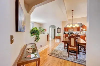 a dining room and kitchen with a table and chairs at Victorian Manor 1 mile from Downtown Denver! in Denver