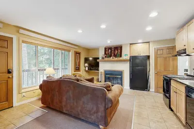 a living room with a couch in a kitchen at On the Rapids - B Unit in Grand Lake