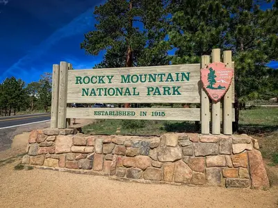 a sign for the rocky mountain national park at Alpine Suite - Minutes to RMNP, Hot Tub! in Estes Park