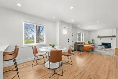 a living room with a table and chairs and a couch at 6224 S Datura St in Littleton