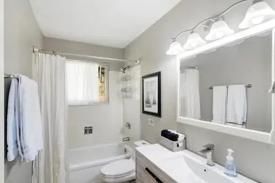 a white bathroom with a sink and a toilet at The Tree House in Evergreen