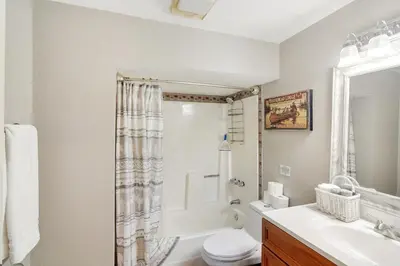 a bathroom with a toilet and a sink at The Tree House in Evergreen